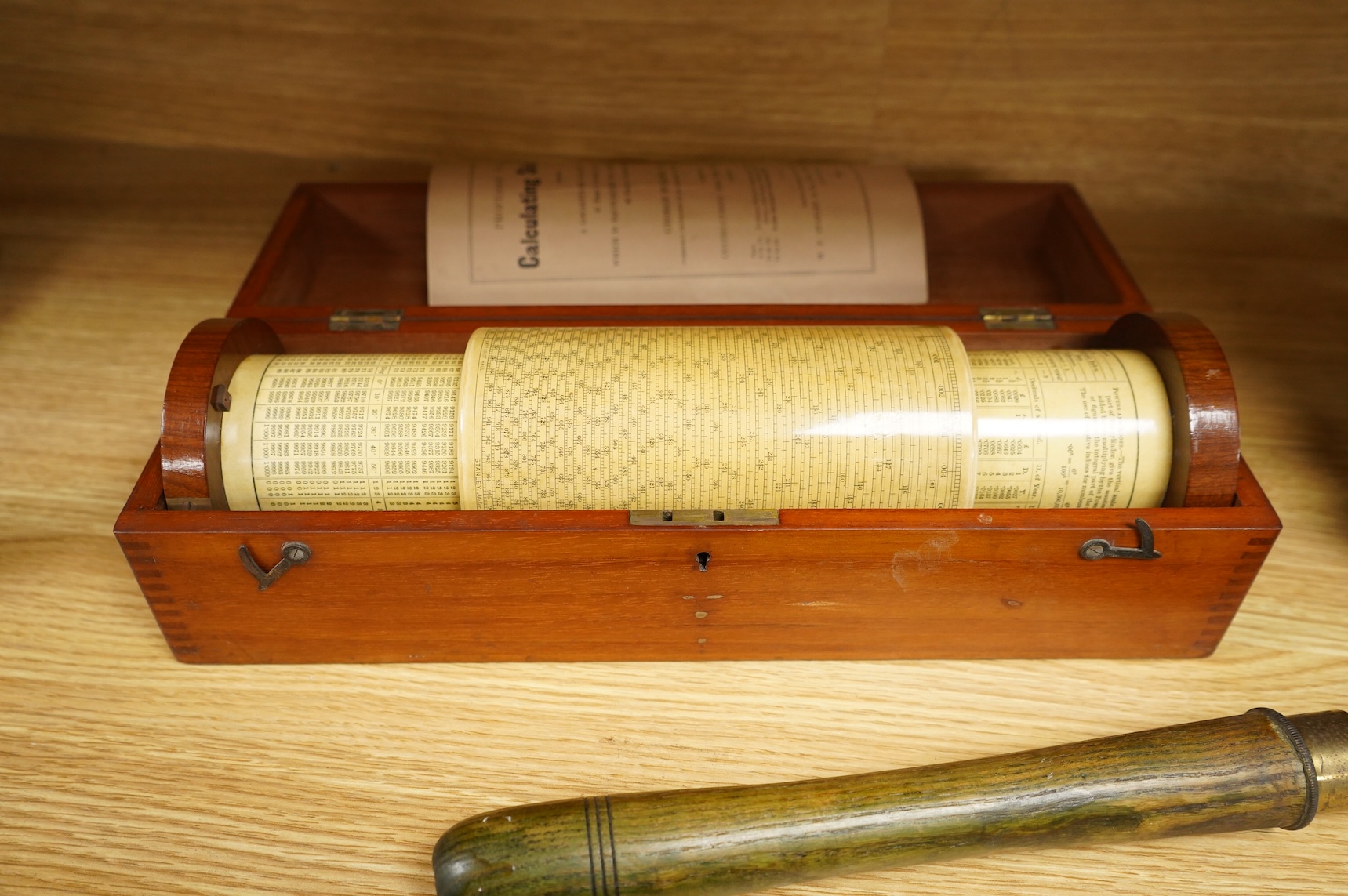 A brass and glass thermometer, with an ash handle, together with an early 19th century brass mining theodolite, by William Wilton, St. Day, Cornwall, (2)